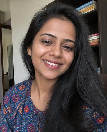 Illustrative portrait of a model, shown as Priya